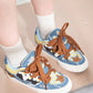 Patchwork-Boardschuhe aus Denim-Canvas mit Kuhmuster